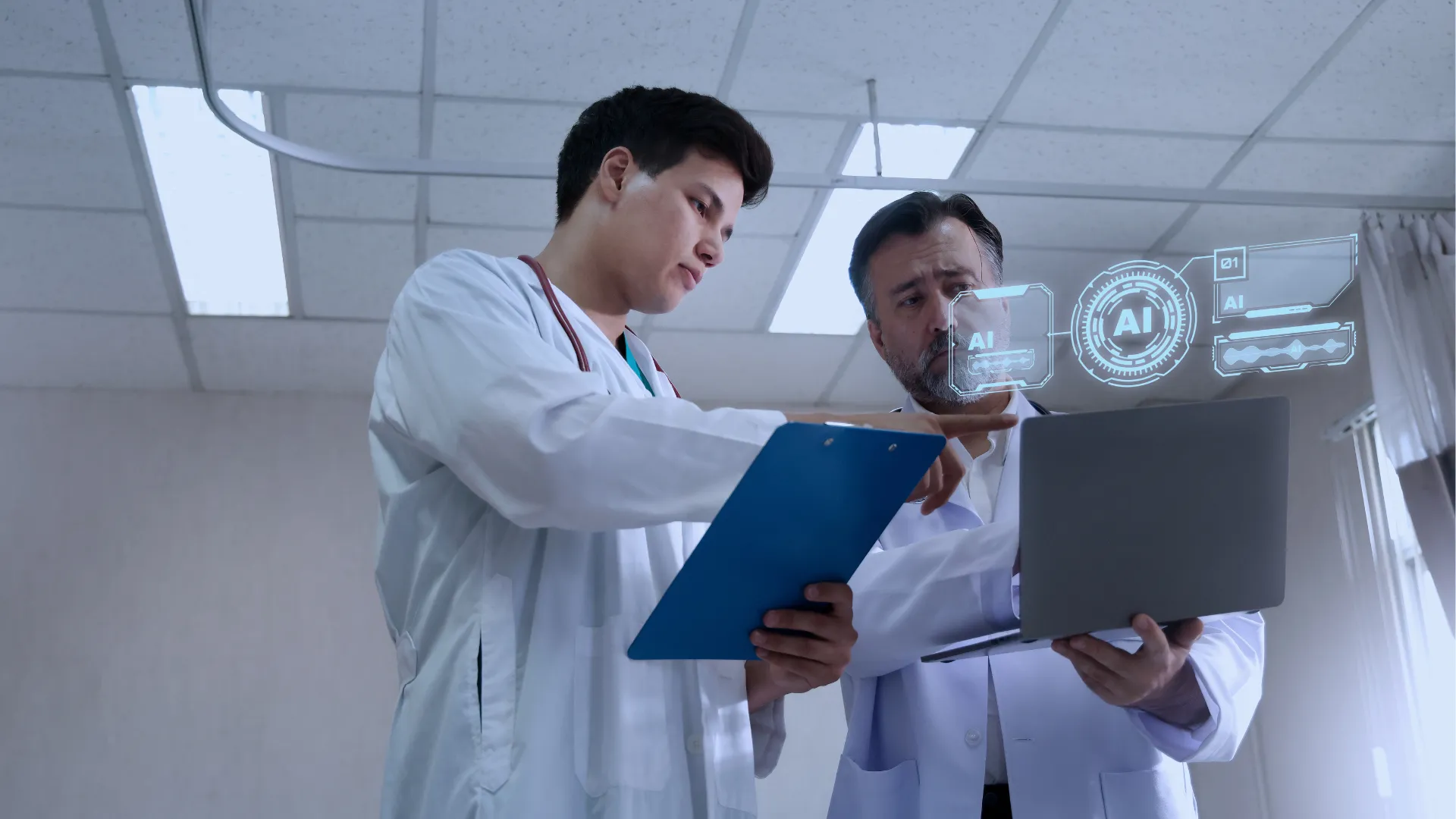 Two clinicians in white coats reviewing results together on a clipboard and a laptop